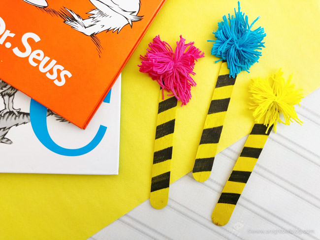 A perfect craft for Read Across America and Dr. Seuss celebrations, make these fun and easy Dr. Seuss Truffula Bookmarks.
